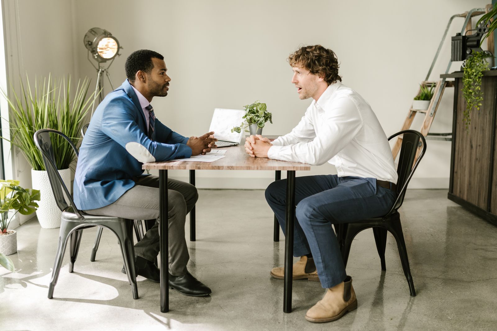 People reviewing real estate investment documents in an office